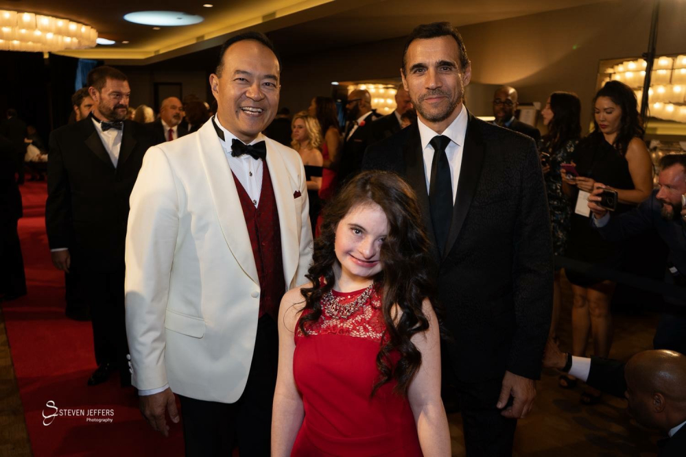 Raymund King and Adrian with Sarah on the Red Carpet