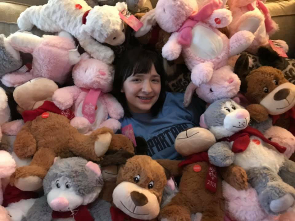 Julianna Gouthiere Surrounded by Stuffed Animals